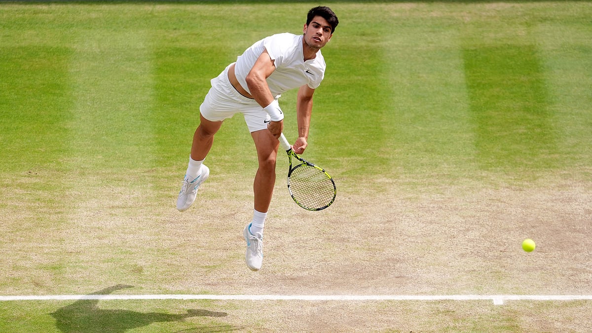 John Walton/PA via AP
 : Carlos Alcaraz of Spain returns the ball to Novak Djokovic of Serbia during the men's singles final at the Wimbledon tennis championships in, Sunday, July 14, 2024.

